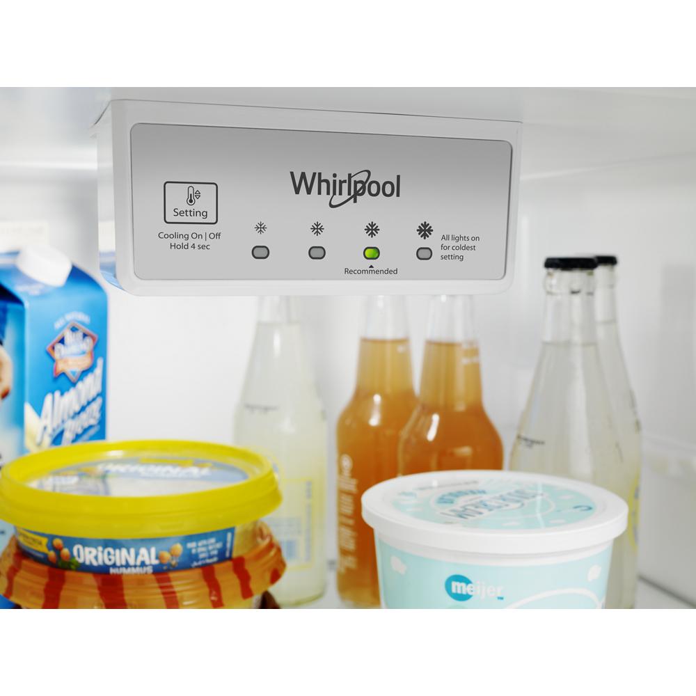 Interior view of Whirlpool refrigerator control panel with dairy, beverages, and condiments in kitchen appliances collection
