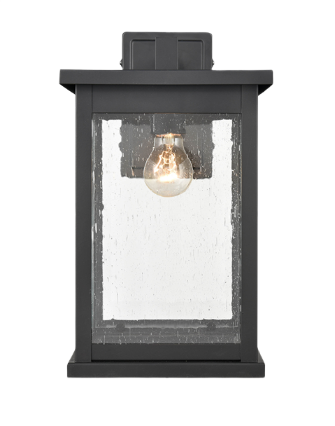 Black outdoor wall light fixture with clear seeded glass and exposed bulb for outdoor living and wall lighting