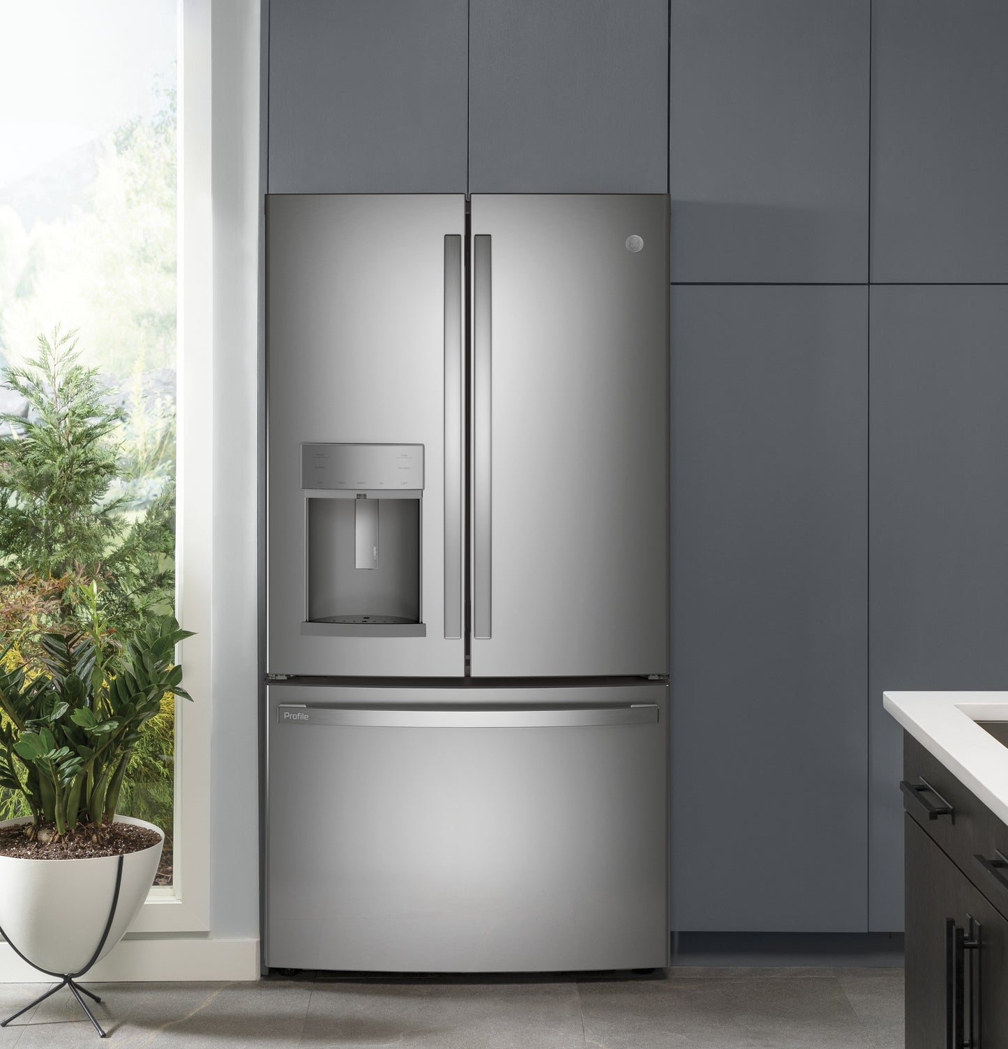 27.7 cu. ft. French-door refrigerator with stainless steel finish, bottom freezer, and built-in water dispenser in kitchen appliances collection