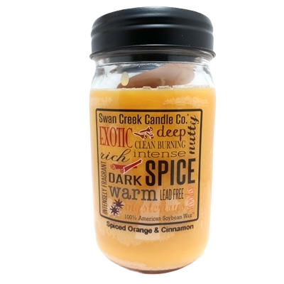 Glass jar candle with spiced orange and cinnamon scent in a black lid container for home fragrance use