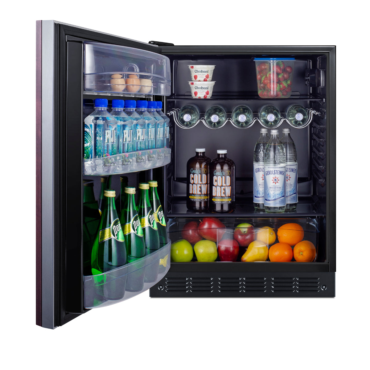Open compact refrigerator with assorted beverages, fruits, and snacks inside in modern kitchen appliance setting