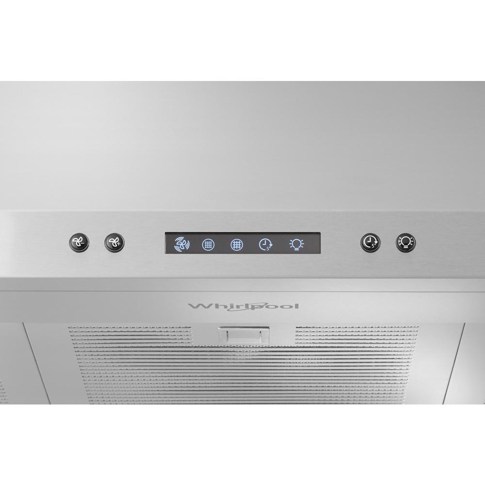 Control panel with fan speed and light buttons on stainless steel wall mounted range hood from kitchen appliances collection