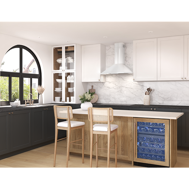 White powder-coated chimney hood with LED lighting above black countertop and marble backsplash in modern kitchen from Range Hoods collection