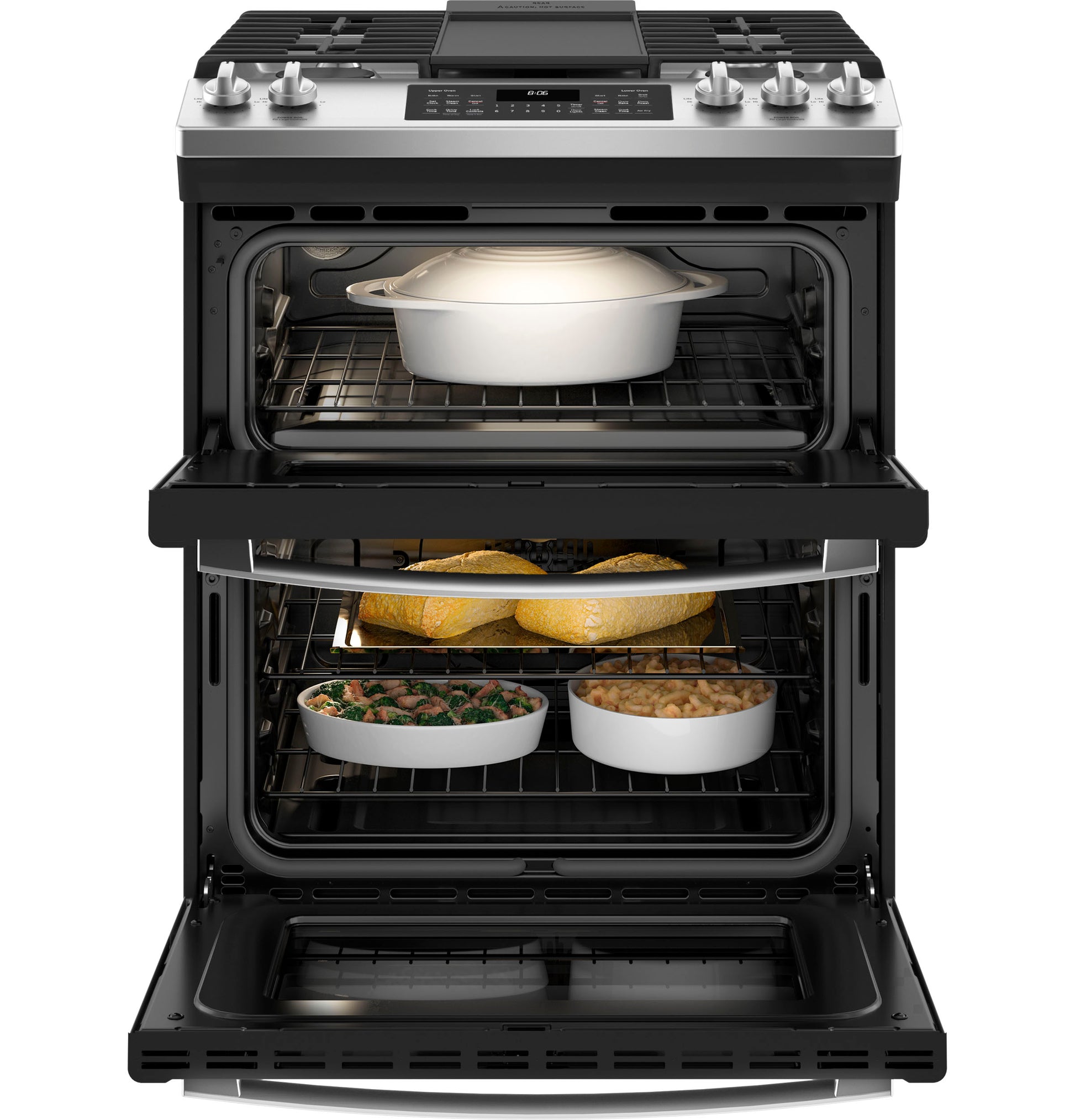 Black gas double oven range with front controls and cookware inside, featured in kitchen appliances collection