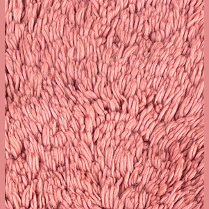 Close-up of soft cotton chenille fabric texture in muted coral pink for kitchen and home use under $50 collection