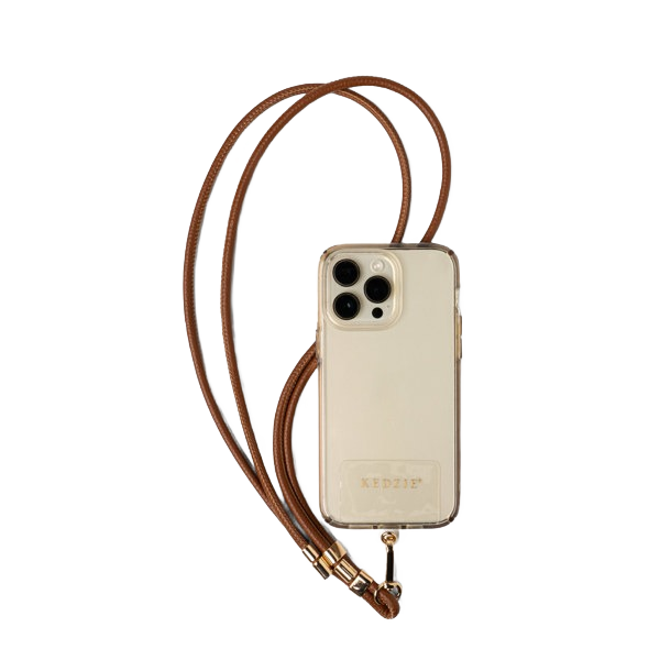 Clear smartphone case with brown vegan leather lanyard featuring goldtone hardware, part of accessories under $50 collection