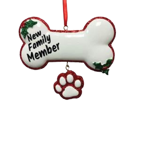 White dog bone Christmas ornament with red glitter trim and hanging paw charm for new pet family celebrations