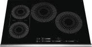 Black glass induction cooktop with four cooking zones and digital touch controls in Kitchen & Kitchenware collection