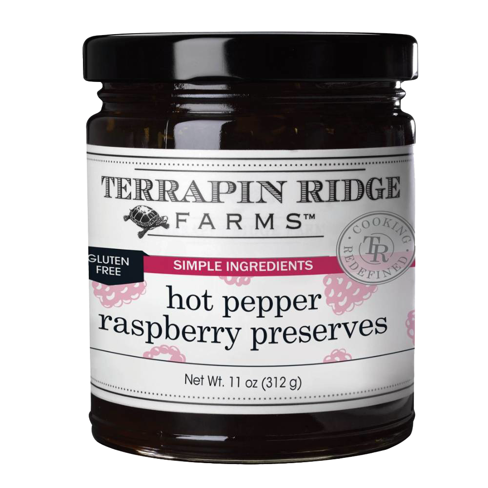 Glass jar of hot pepper raspberry preserves with black lid, part of Jams & Jellies and Food & Beverage collections under $50