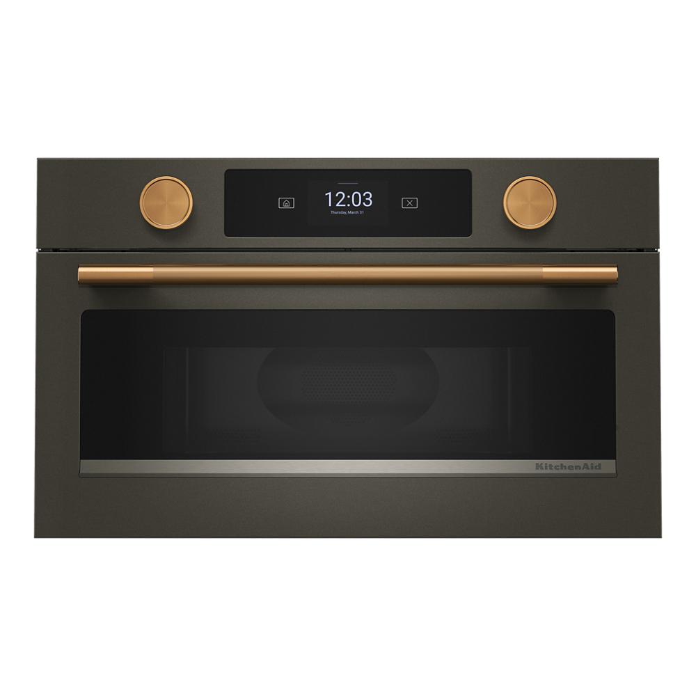 Built-in microwave oven in dark stainless steel with gold-tone handle and knobs, digital display in KitchenAid Appliances collection