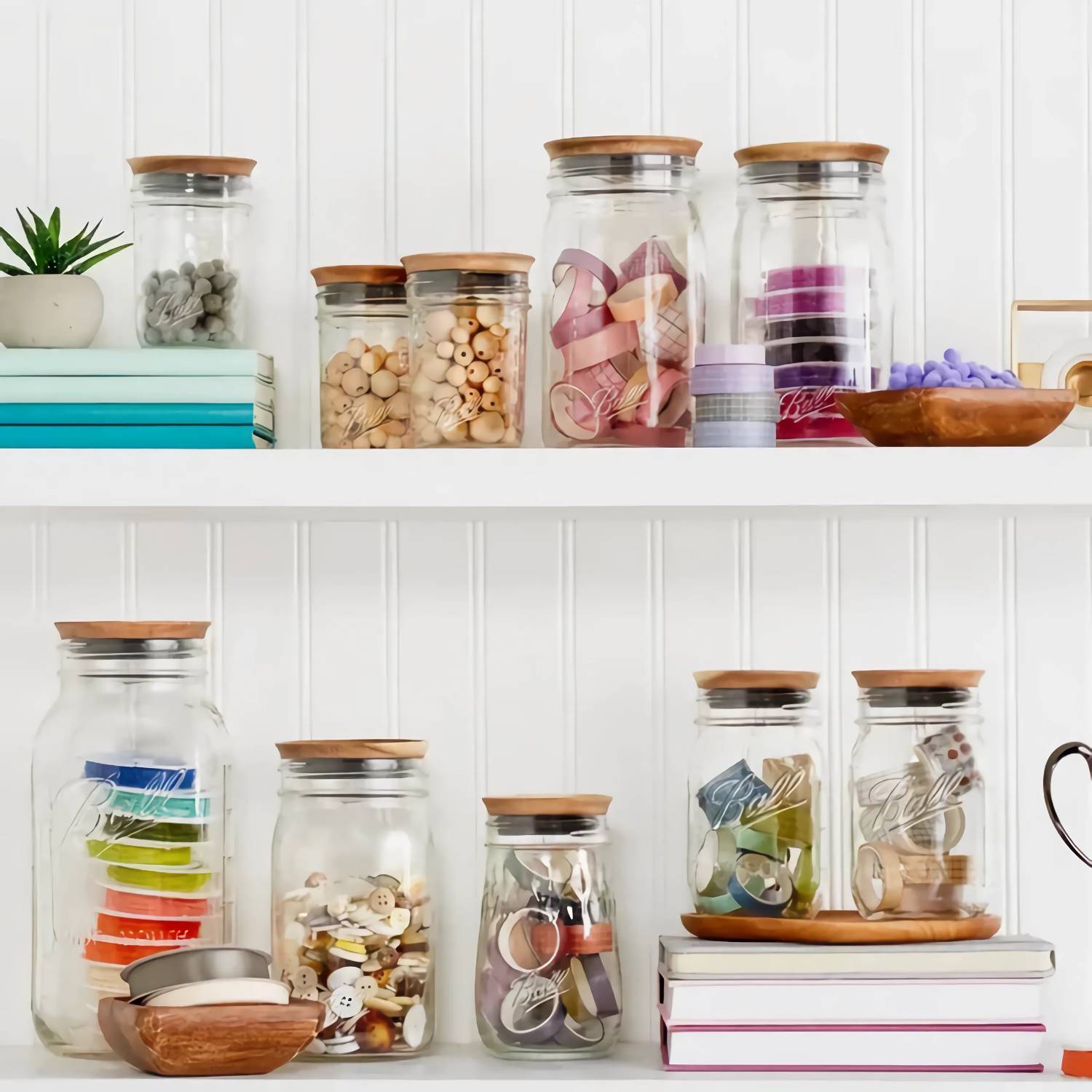 Glass jars with wooden lids storing craft supplies and buttons on kitchenware shelves under $50 collection