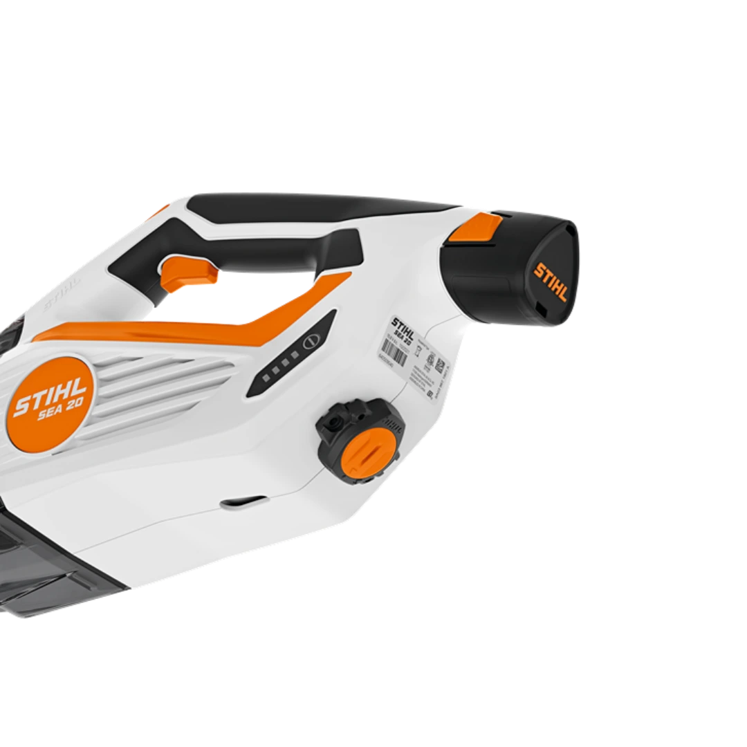 White and orange handheld battery-powered vacuum with ergonomic handle and compact design for home improvement tasks