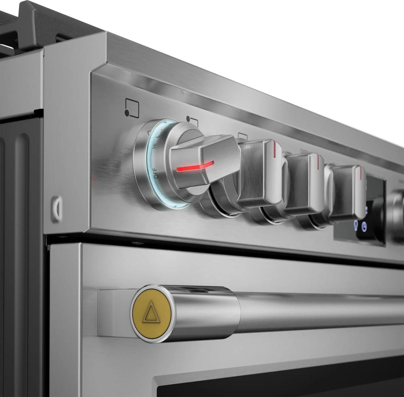 Close-up of stainless steel gas range control knobs with illuminated settings in Ranges and Kitchen & Kitchenware collections