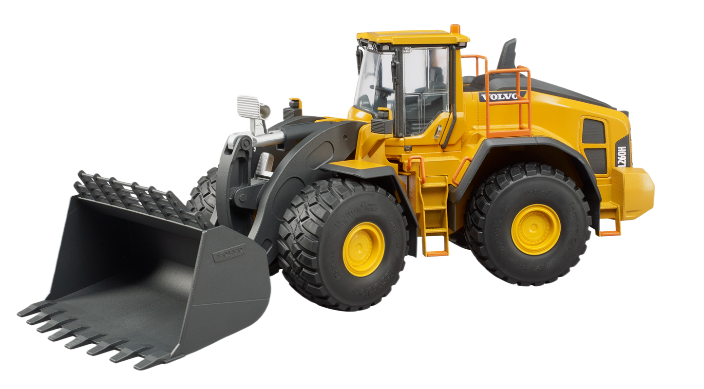 Yellow Bruder Volvo wheel loader toy with rugged black front bucket and realistic cabin for construction-themed play