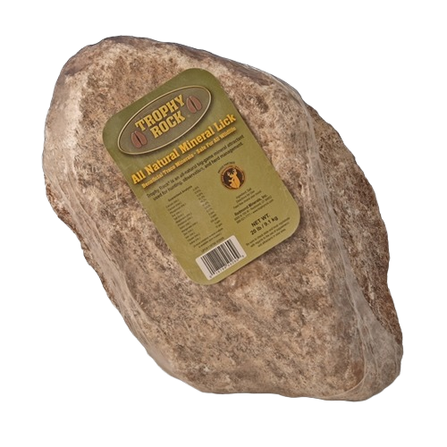 Large natural mineral lick block with label for wildlife nutrition and habitat enhancement