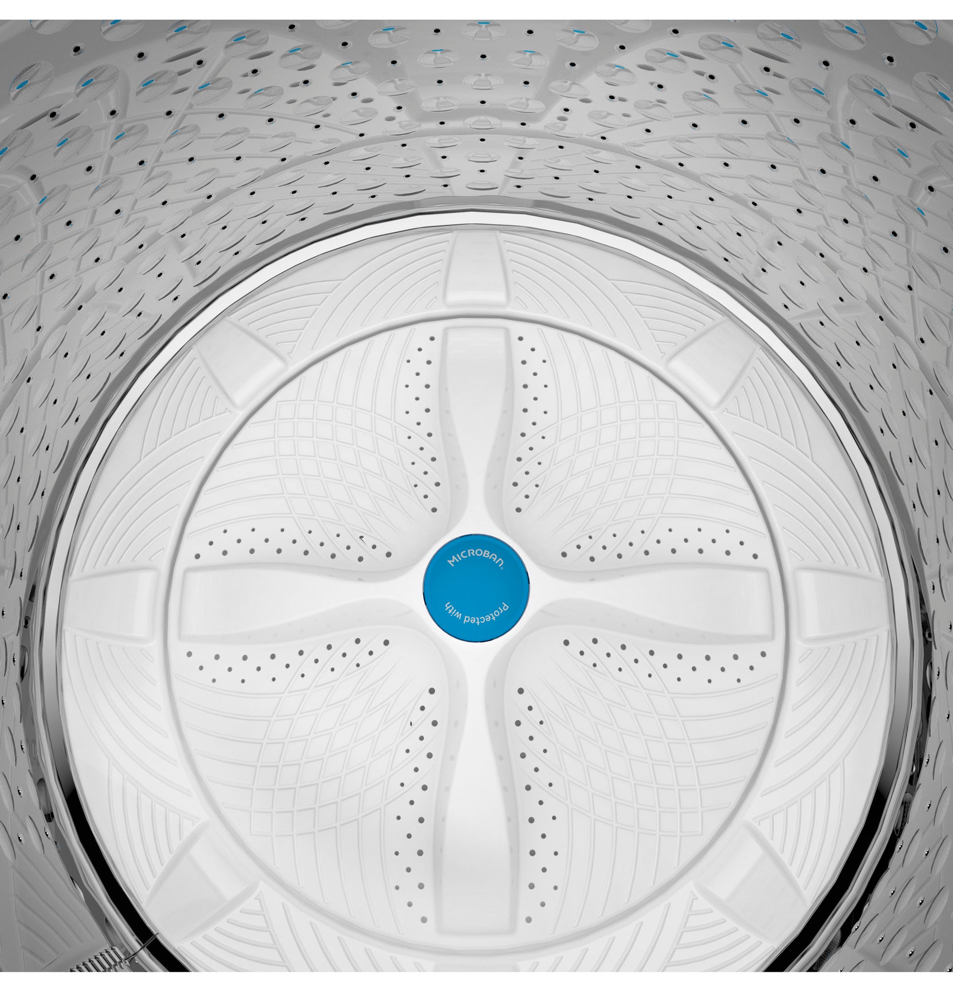 Top view inside washer drum showing textured wash plate design with Microban antimicrobial feature in top load washer drum
