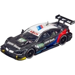 Black and blue 1:32 scale BMW M4 DTM slot car with racing decals and aerodynamic rear wing