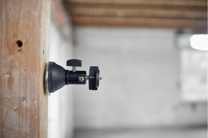 Magnetic adapter base with adjustable mount attached to wooden beam for tool accessories in home improvement
