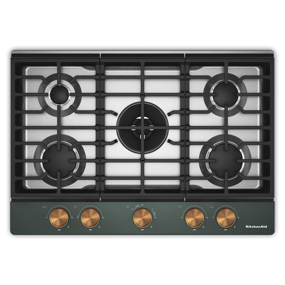 Top view of a stainless steel 30-inch gas cooktop with five burners, integrated wok grate, and copper-toned weighted control knobs for home improvement and kitchenware.