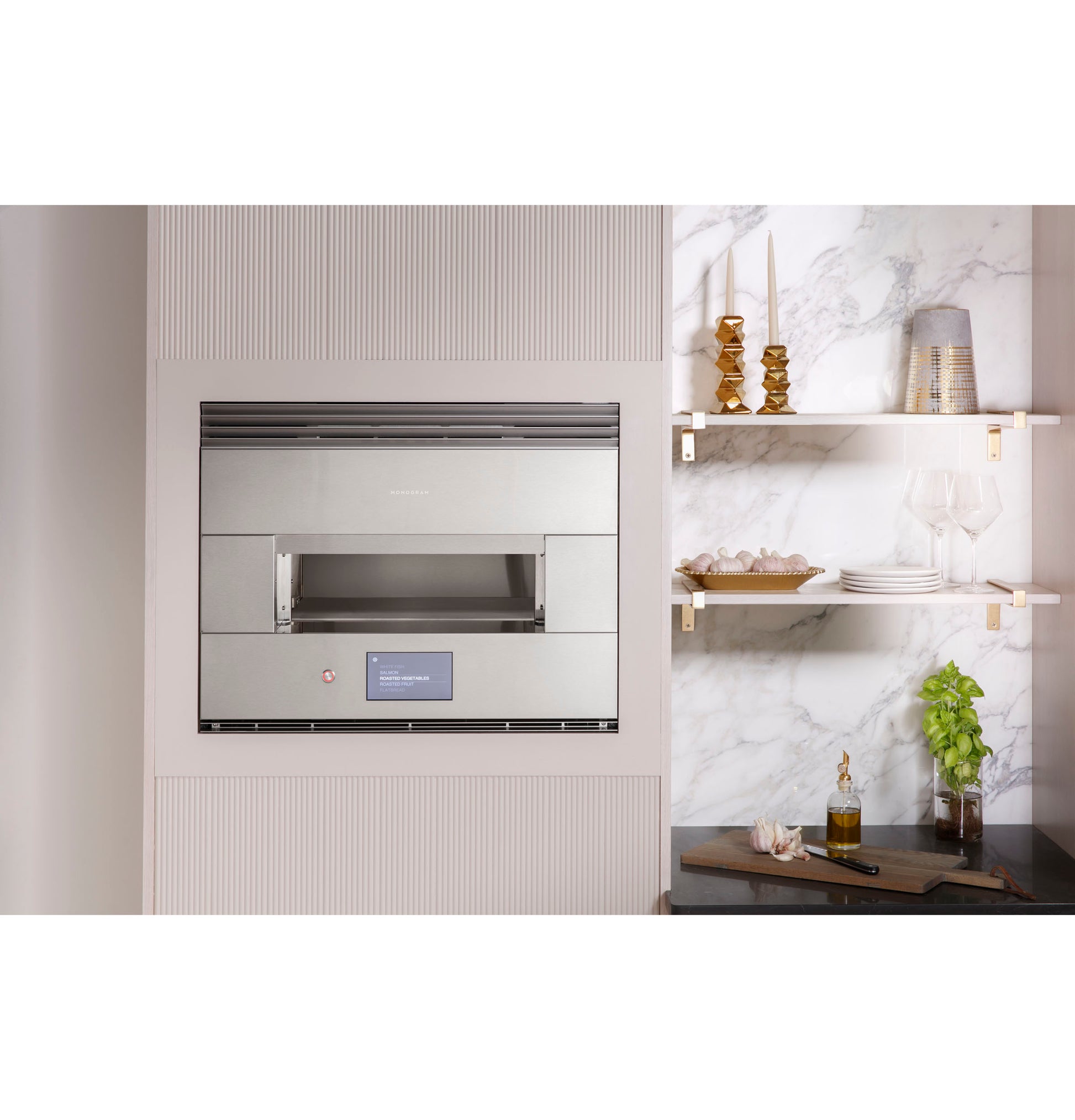Built-in stainless steel wall oven with digital touchscreen and heat vent in modern kitchen setting with shelves