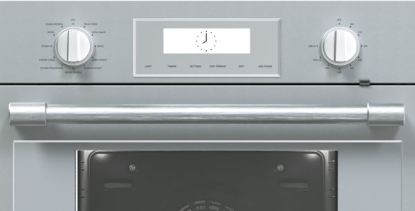 Close-up of stainless steel oven control panel with knobs and digital timer in Thermador double wall ovens collection