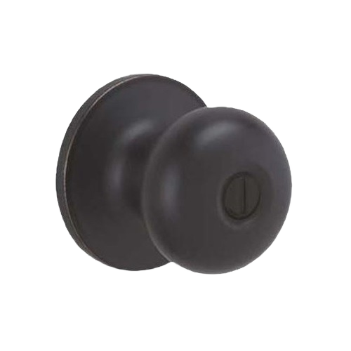 Round privacy door handle in aged bronze finish designed for home improvement and interior privacy use