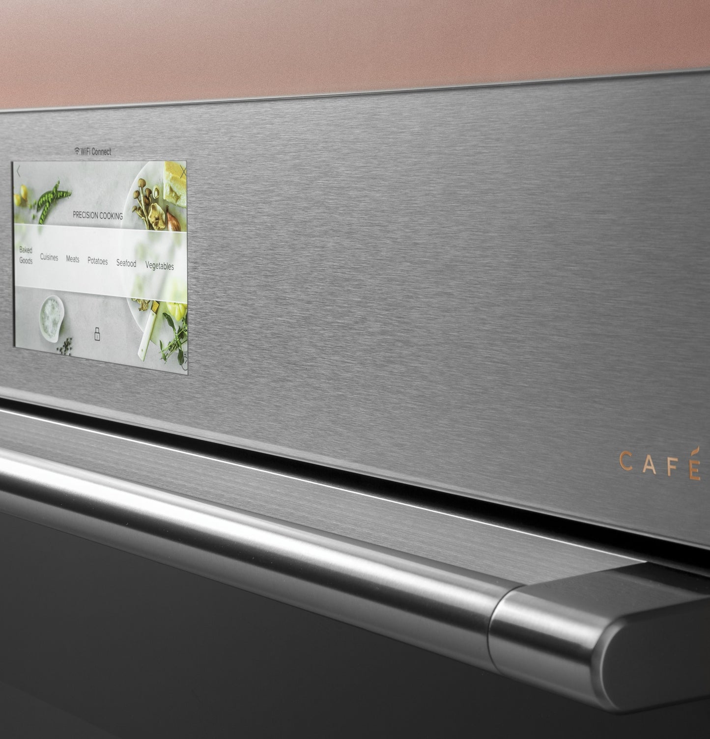 Close-up of stainless steel smart wall oven with touchscreen panel and platinum glass finish in kitchen appliance setting
