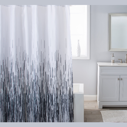 Bathroom scene featuring a black and white rain pattern shower curtain with a clean, modern vanity and neutral decor