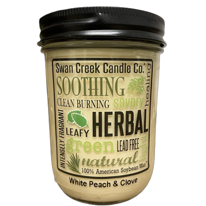 Jar candle scented with white peach and clove, made from clean-burning 100% American soybean wax under $50 decor.