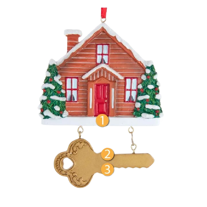 Red and brown house ornament with two snow-tipped pine trees and a decorative gold key for holiday decor under $50 collections