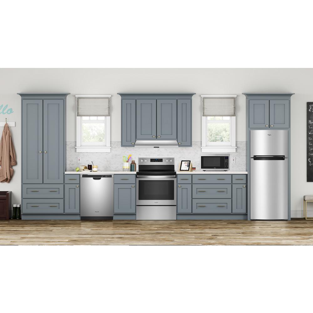 Modern kitchen with stainless steel appliances including refrigerator, dishwasher, oven, and gray cabinetry against white walls