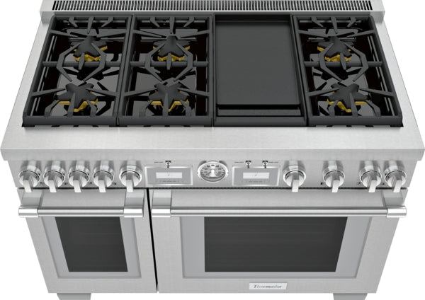 Stainless steel dual fuel professional range with six burners, central griddle, dual ovens, and control knobs from Ranges collection