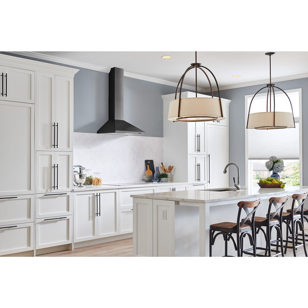 Modern kitchen with black pyramidal chimney range hood, white cabinetry, island seating, and pendant lighting in home improvement setting