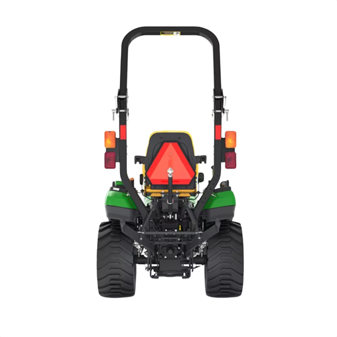 Rear view of green utility tractor with wide tires, rollover bar, and red triangular slow-moving vehicle sign