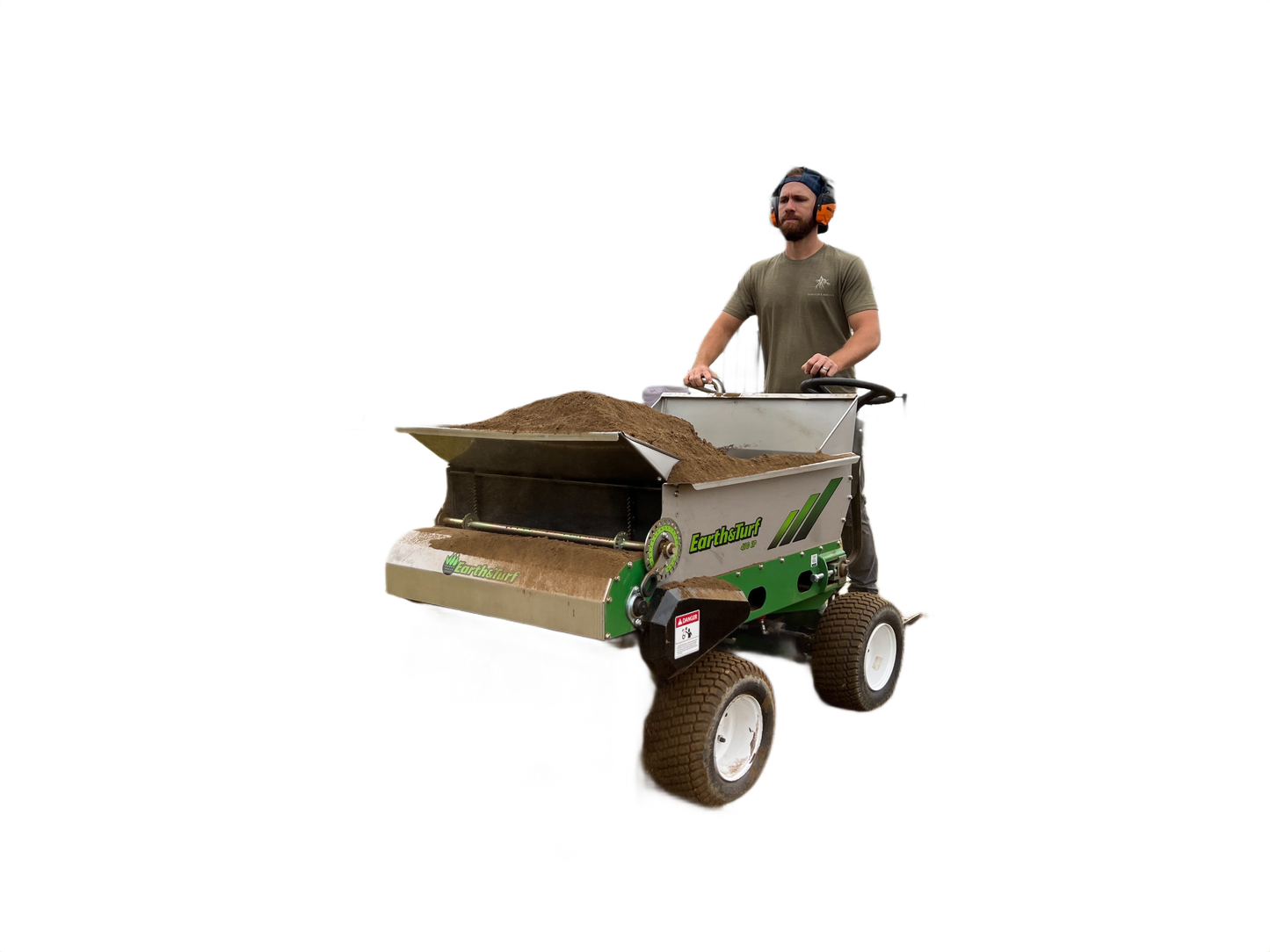 Operator standing on green and gray four-wheel steer top dresser spreading soil for landscaping in All Products collection