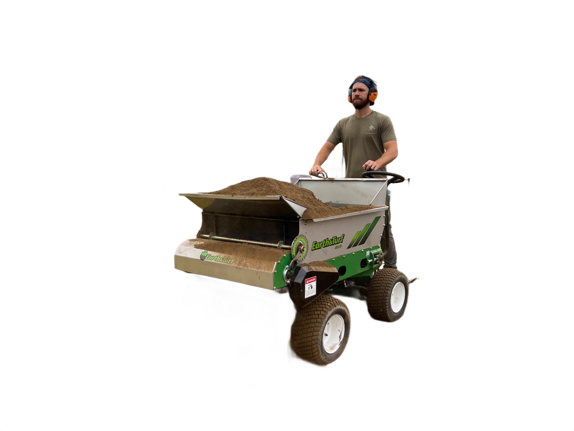 Operator standing on green and gray four-wheel steer top dresser spreading soil for landscaping in All Products collection