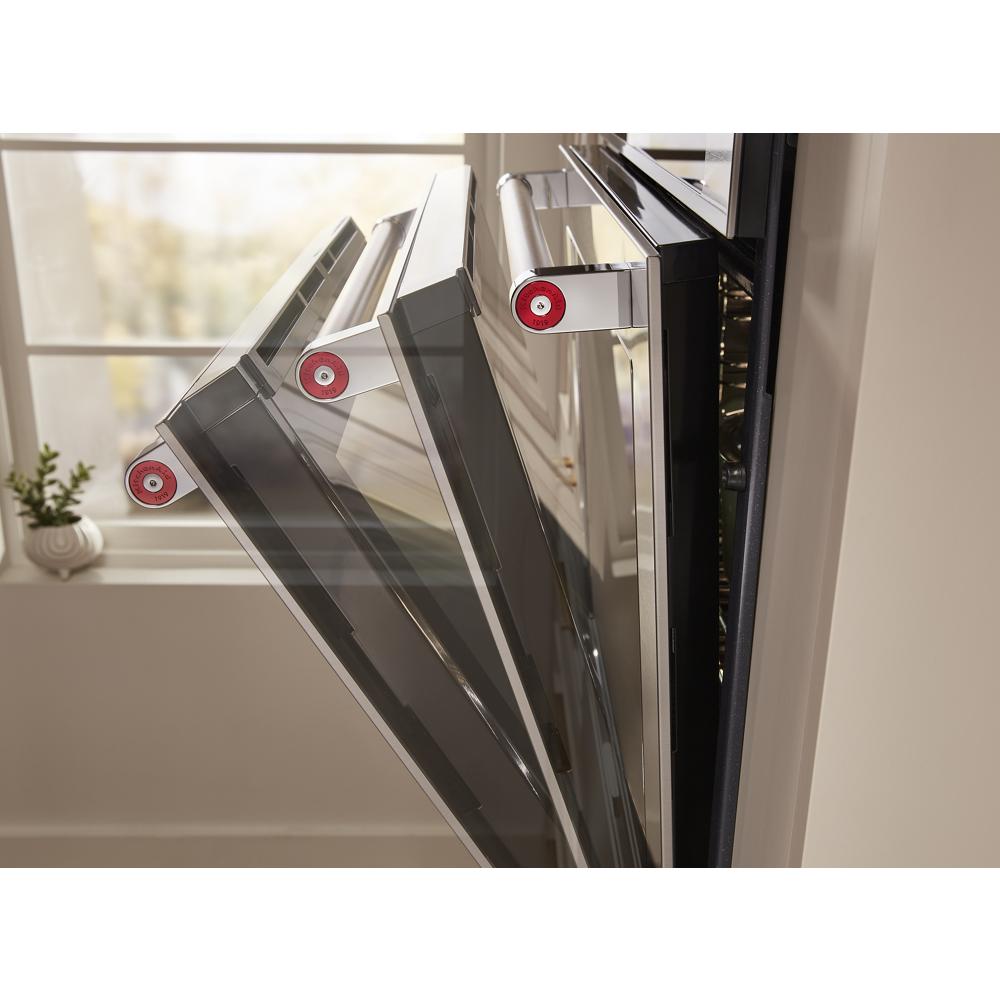 Stainless steel smart wall oven door shown opening at multiple angles in a bright kitchen setting
