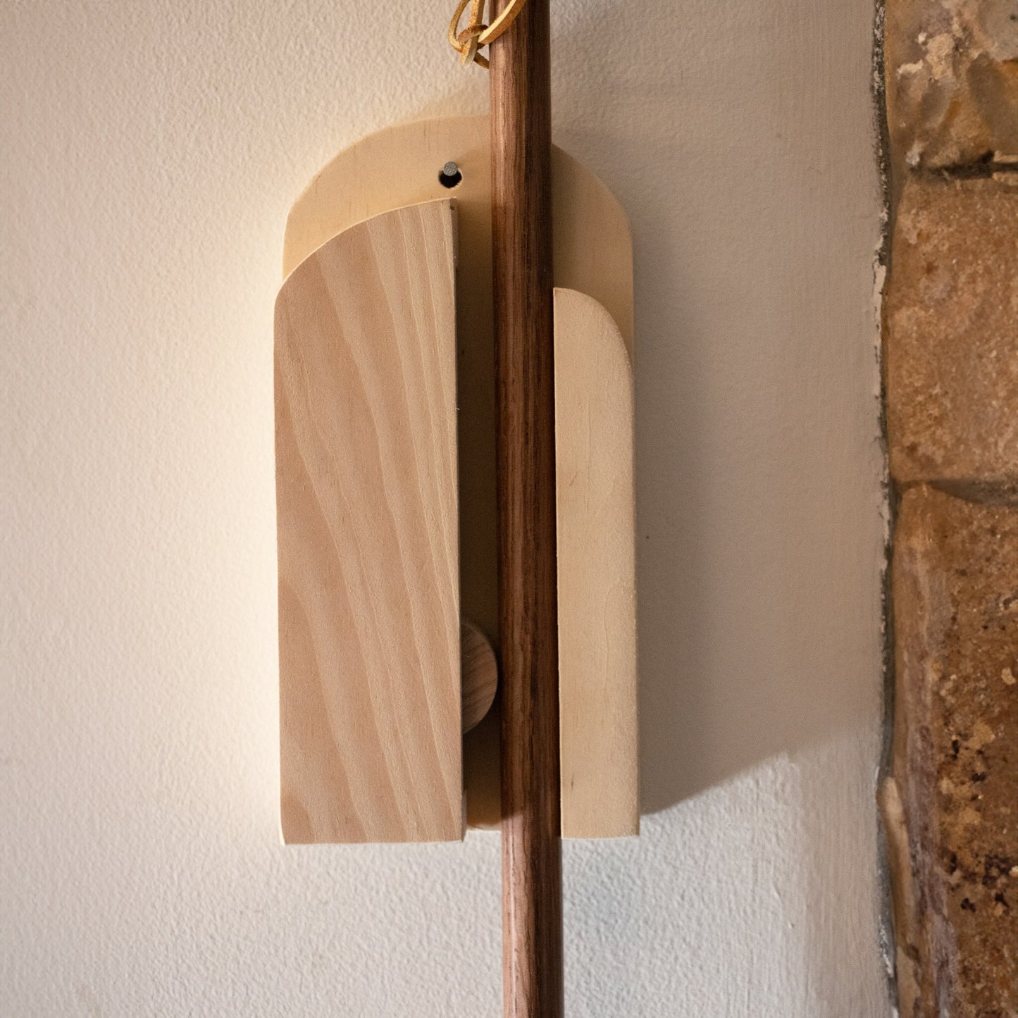 Handmade wooden wall broom holder securing a broom in place for organized storage in Cleaning Tools under $50 collections