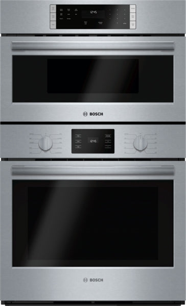 Stainless steel industrial-style combination oven with digital displays and heavy-duty metal knobs in wall ovens collection