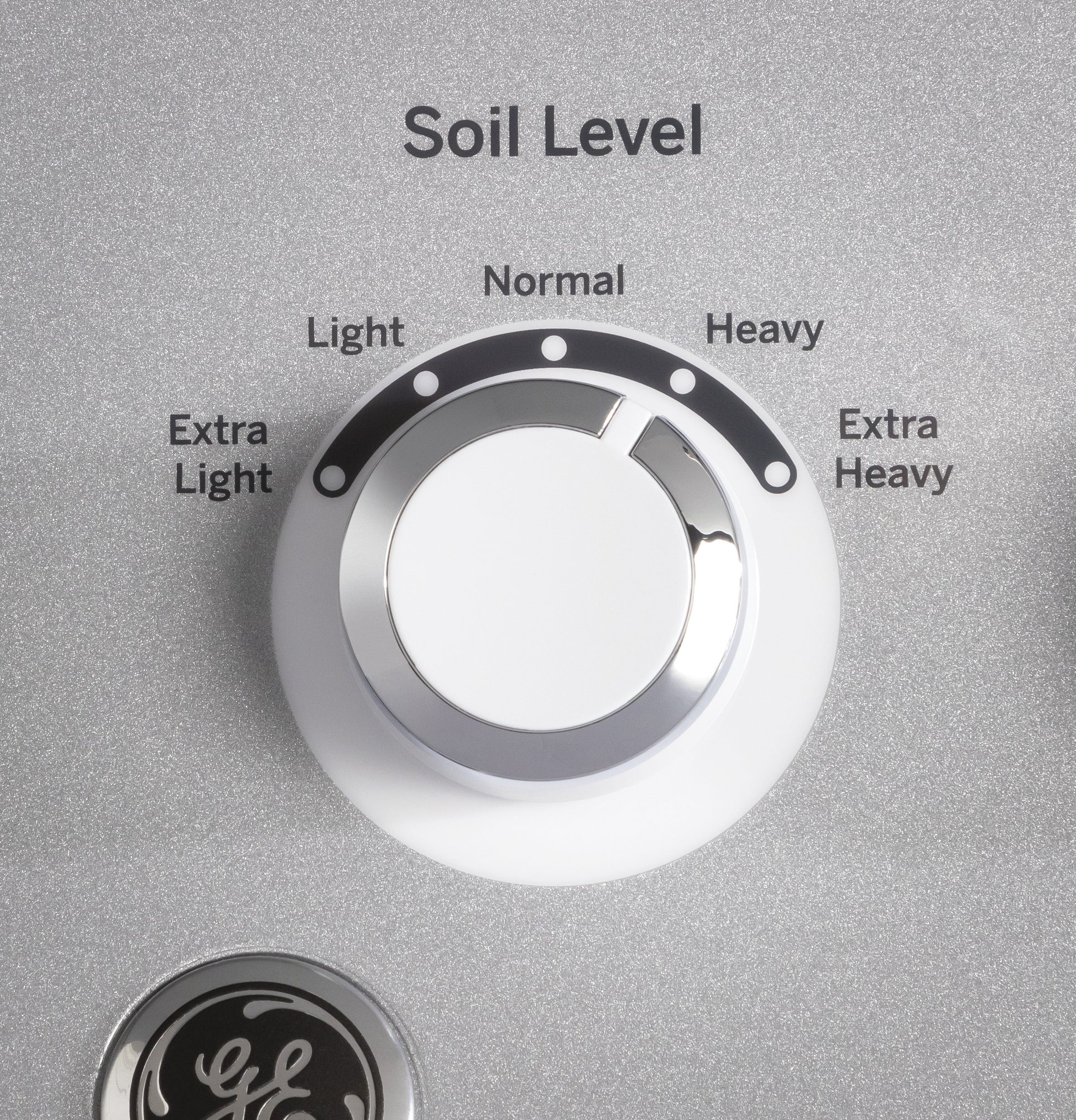 Close-up of soil level control knob on washer with settings ranging from extra light to extra heavy soil level