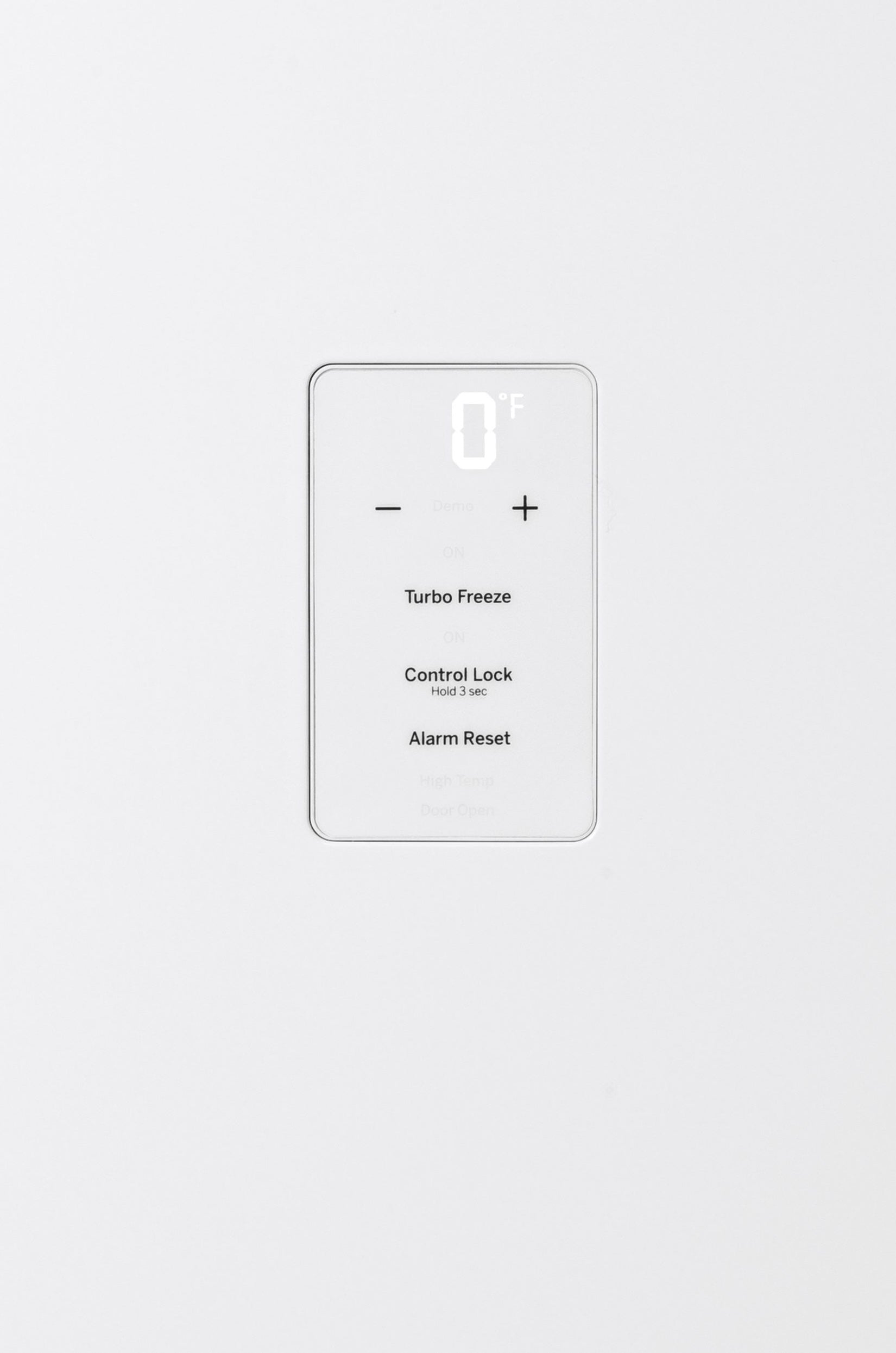 Digital control panel with temperature display and settings for turbo freeze, control lock, and alarm reset on white freezer