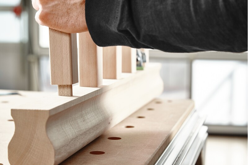 Hand fitting a beech wood domino tenon into a woodworking joint for precise home improvement and tool accessories use