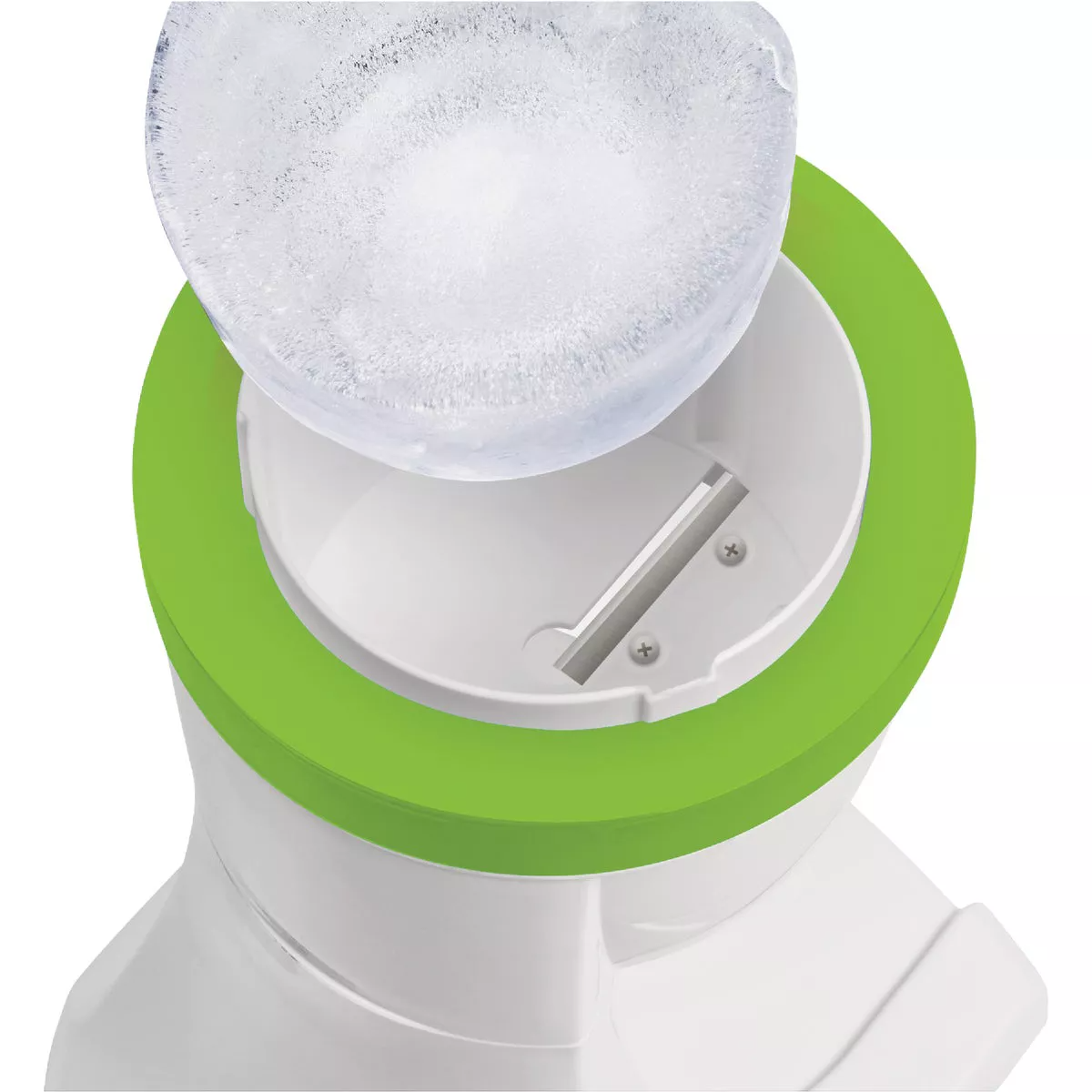 Top view of a white and green shave ice machine with a block of ice ready for shaving
