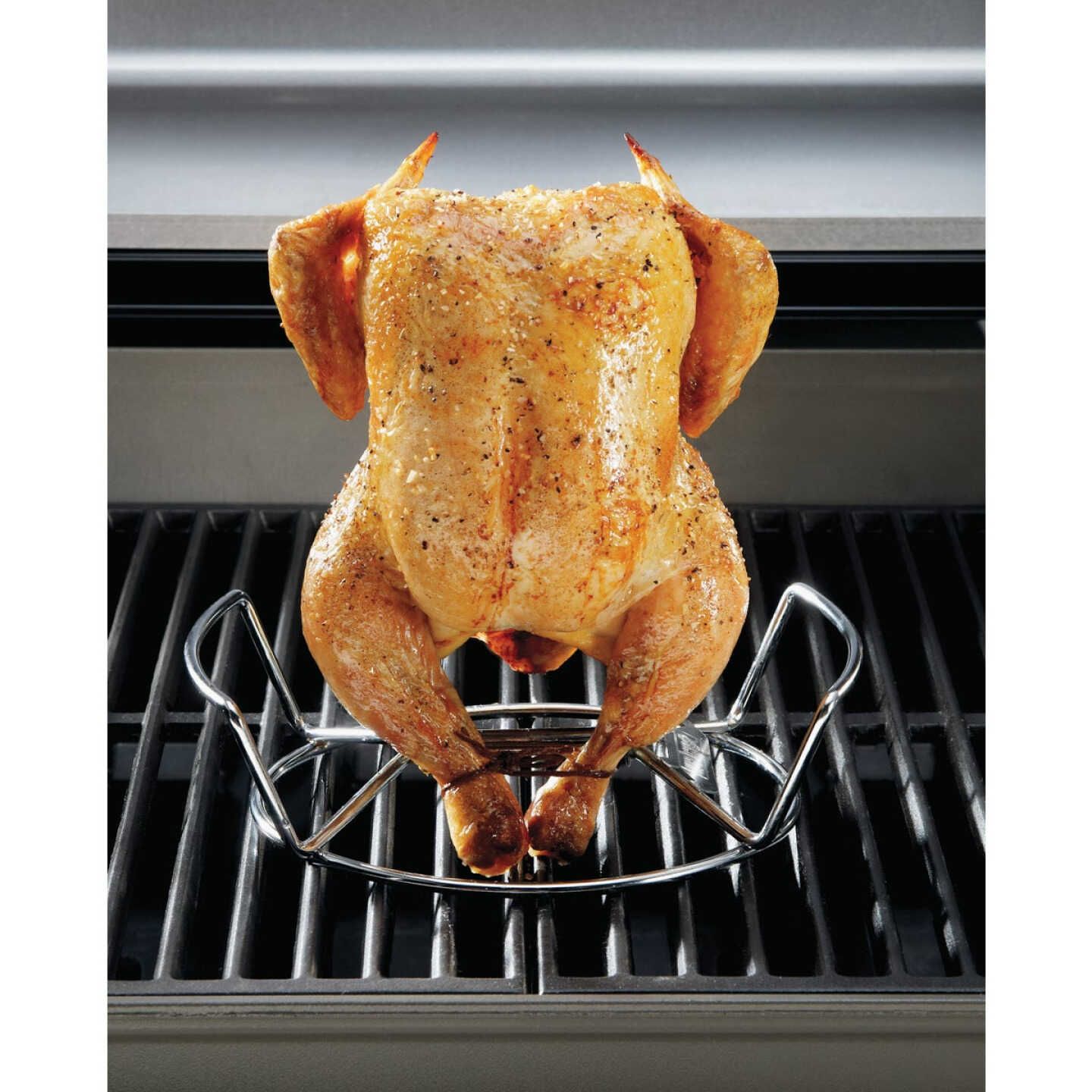 Steel nesting poultry roaster holding seasoned whole chicken upright on grill for even cooking in outdoor living collections