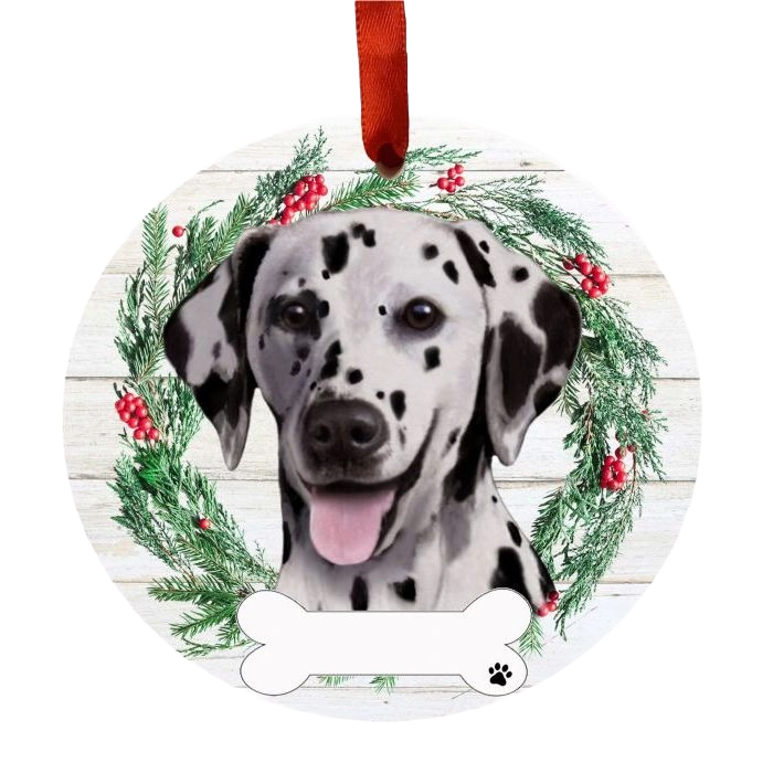 Round Christmas ornament featuring a Dalmatian face inside a festive green wreath with red berries and bone-shaped tag