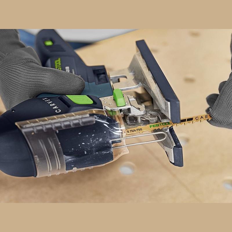 Close-up of a Festool jigsaw with a blade cutting through wood in woodworking and power tool accessories collections