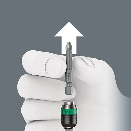 Hand demonstrating quick-release bit removal from ergonomic tool holder in hand tools and woodworking collections under $100