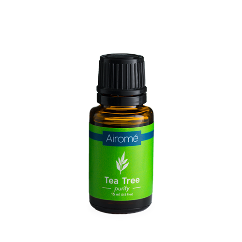 Amber glass bottle of tea tree essential oil with green label for home decor and wellness under $50