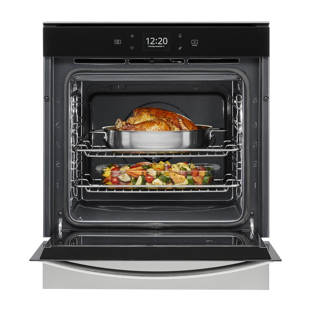 Open 24 inch convection wall oven roasting a whole chicken and vegetables on separate racks from Kitchen & Kitchenware collection