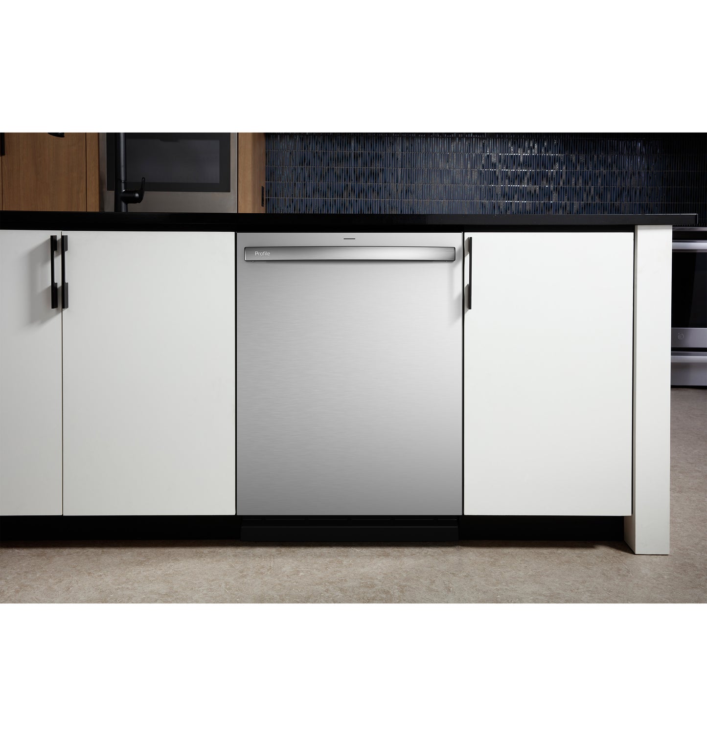 Built-in stainless steel dishwasher installed under black countertop between white cabinetry in modern kitchen setting from Dishwashers collection